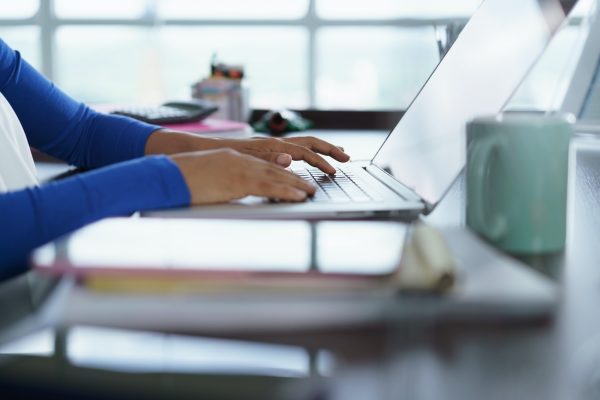 Latina Girl Studying At Home With Laptop Computer